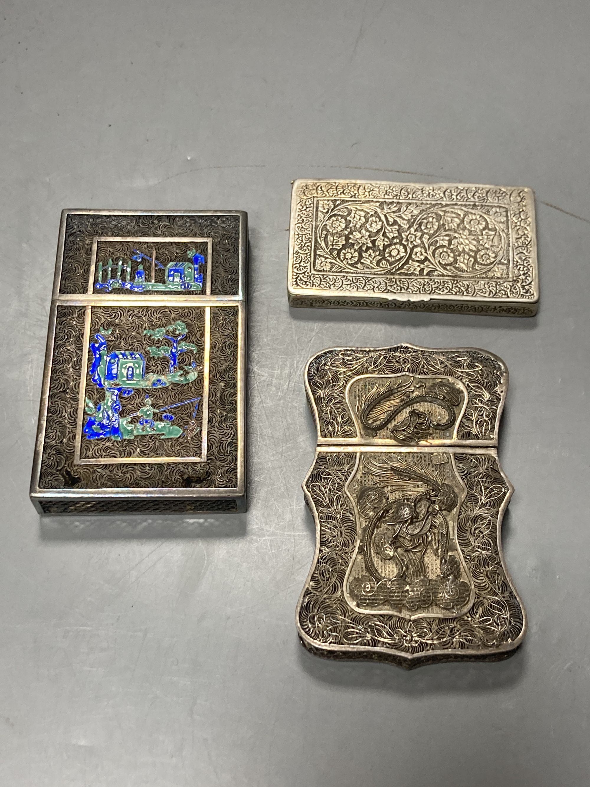 Two Chinese white metal filigree card cases, one with enamel(a.f.) & an Indian white metal snuff box, largest 91mm.